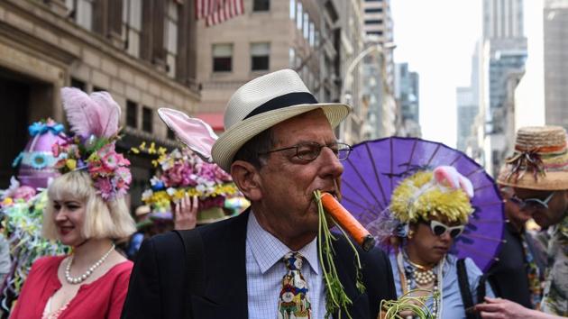 People wear fanciful hats during the Easter Parade and Bonnet Festival. (Stephanie Keith / AFP) People wear fanciful hats during the Easter Parade and Bonnet Festival. (Stephanie Keith / AFP)