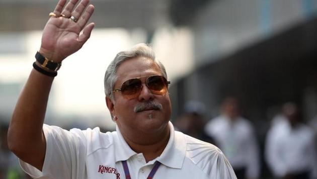 Vijay Mallya waves in the paddock during the a practice session of the Indian F1 Grand Prix at the Buddh International Circuit in Greater Noida, on the outskirts of New Delhi.(Reuters File)