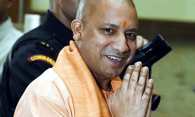 UP chief minister Yogi Adityanath arrives for a cabinet meeting at Lok Bhawan in Lucknow on Tuesday. He had directed authorities to take action against tainted cops and to launch a drive against criminal gangs(PTI)
