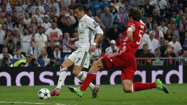 Real Madrid's Cristiano Ronaldo scores to complete his Champions League hattrick against Bayern Munich on Tuesday (REUTERS)