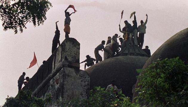 This file photo taken on December 6, 1992 shows Hindu fundamentalists shouting and waving banners as they stand on top of a stone wall and celebrate the destruction of the 16th century Babri Mosque in Ayodhya. (AFP) This file photo taken on December 6, 1992 shows Hindu fundamentalists shouting and waving banners as they stand on top of a stone wall and celebrate the destruction of the 16th century Babri Mosque in Ayodhya. (AFP)