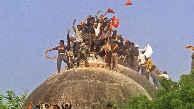 In this photograph taken on December 6, 1992, a Hindu mob attacks the 16th century Babri Masjid in Ayodhya. The Supreme Court on Wednesday revived criminal conspiracy charges against BJP leaders LK Advani, Murli Manohar Joshi, Uma Bharti and nine others. (AFP file) In this photograph taken on December 6, 1992, a Hindu mob attacks the 16th century Babri Masjid in Ayodhya. The Supreme Court on Wednesday revived criminal conspiracy charges against BJP leaders LK Advani, Murli Manohar Joshi, Uma Bharti and nine others. (AFP file)
