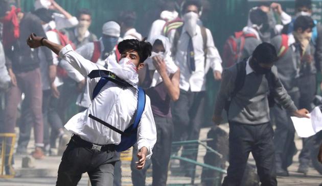 Kashmiri students clash with forces in Srinagar, April 17. Stone-throwing protesters, some of them children, target police, soldiers and public property in repeated protests in the Kashmir Valley. Security forces, officially ordered to act with restraint and forbidden to use live ammunition except as a last resort, have still caused large numbers of deaths and injuries.(Waseem Andrabi/HT Photo)