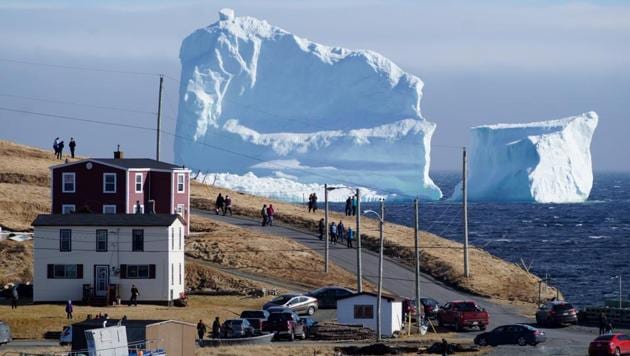 The icebergs are often locked into sea ice, which can last until late spring or early summer, but this one looks like it has grounded and could remain in place, Mayor Adrian Kavanagh told The Canadian Press. (Jody Martin / REUTERS)