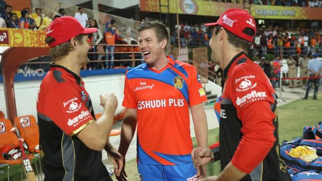 The Australian trio (starting from left) Shane Watson, James Faulkner and Travis Head chat post match. Faulkner is yet to play a game for Gujarat Lions this season. (BCCI )