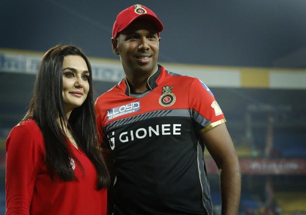 Preity Zinta with Samuel Badree of the Royal Challengers Bangalore after Kings XI Punjab’s match against the Virat Kohli-led team on April 10. (BCCI/Sportzpics)