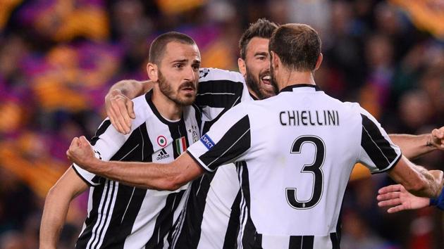 Juventus F.C. defender Giorgio Chiellini (right) celebrates with teammates at the end of their UEFA Champions League quarterfinal second leg match against FC Barcelona at the Camp Nou in Barcelona on Wednesday.(AFP)