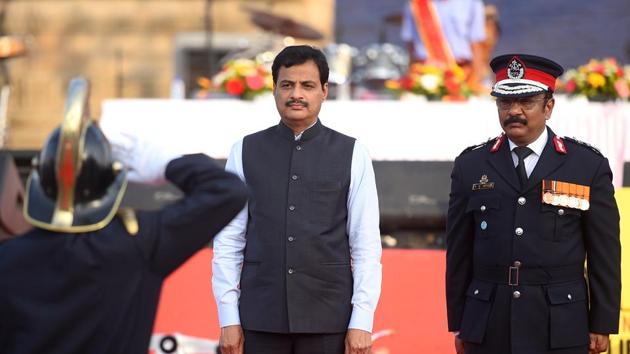 An official salutes minister for home (state) Ranjit Patil during the ceremony. (Pratik Chorge/HT Photo)