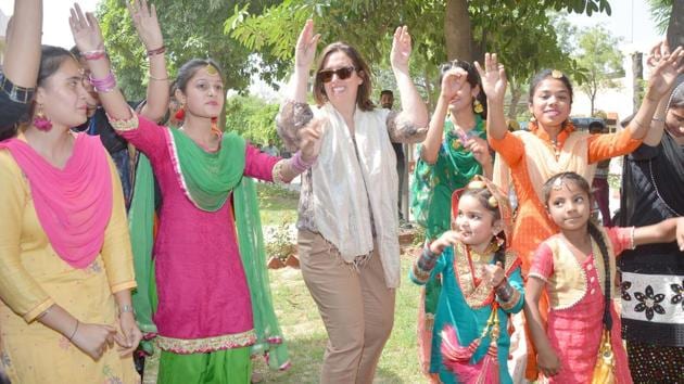 A Canadian delegate dancing during the Pingalwara visit. (Gurpreet Singh/HT)