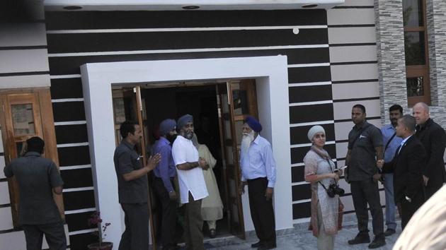 Sajjan Singh with his parents at their house in Bombeli village on Thursday. (Ravi Kumar/HT)