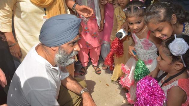 The Canadian defence minister interacting with physically and mentally-challenged Pingalwara residents in Amritsar on Thursday. (Gurpreet Singh/HT)