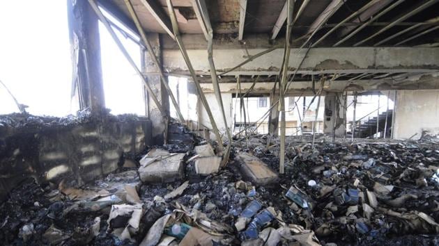 The five-storey building (including the basement) of Excel Greentech was engulfed in flames on Wednesday afternoon. The fire spread quickly due to inflammable material such as LED lights and paper cartons.(Sunil Ghosh/HT Photo) The five-storey building (including the basement) of Excel Greentech was engulfed in flames on Wednesday afternoon. The fire spread quickly due to inflammable material such as LED lights and paper cartons.(Sunil Ghosh/HT Photo)
