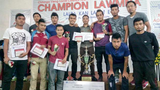 Players of Chinga Veng FC, a community club of Mizoram, posing with the trophy and certificates after winning a popular inter-village and local council championship in the state. (HT Photo) Players of Chinga Veng FC, a community club of Mizoram, posing with the trophy and certificates after winning a popular inter-village and local council championship in the state. (HT Photo)