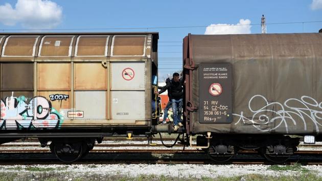 Algerian migrants are seen on a freight train before its departure, in an effort to cross the Greek-Macedonian border. (Alexandros Avramidis /Reuters) Algerian migrants are seen on a freight train before its departure, in an effort to cross the Greek-Macedonian border. (Alexandros Avramidis /Reuters)