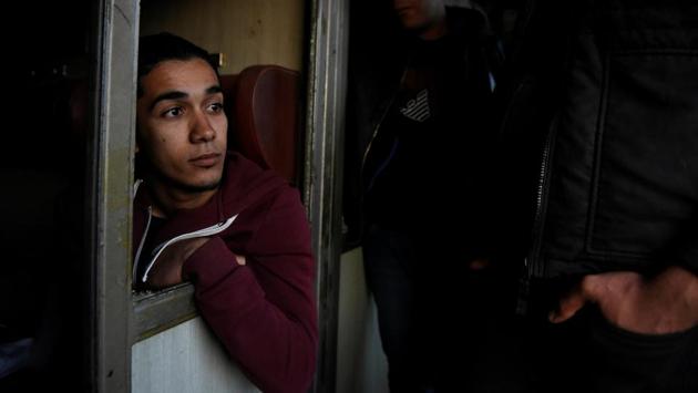 Habib, 22, from Algeria is seen with his friends on an abandoned railway wagon used as a shelter.On April 6, Habib and his friends jumped on a freight train in an effort to cross the Greek-Macedonian border without documents. They were arrested in Macedonia and returned back to Greece. (Alexandros Avramidis /Reuters) Habib, 22, from Algeria is seen with his friends on an abandoned railway wagon used as a shelter.On April 6, Habib and his friends jumped on a freight train in an effort to cross the Greek-Macedonian border without documents. They were arrested in Macedonia and returned back to Greece. (Alexandros Avramidis /Reuters)