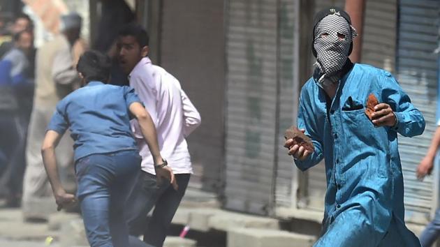 Stone pelting is a common form of protest in the Kashmir valley with 2,690 cases registered in 2016, according to the state government figures (AFP Photo) Stone pelting is a common form of protest in the Kashmir valley with 2,690 cases registered in 2016, according to the state government figures (AFP Photo)