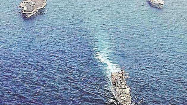 File photo of ships assigned to the USS Nimitz Carrier Strike Group and the Indian aircraft carrier Viraat underway in the Indian Ocean.(AFP File Photo)