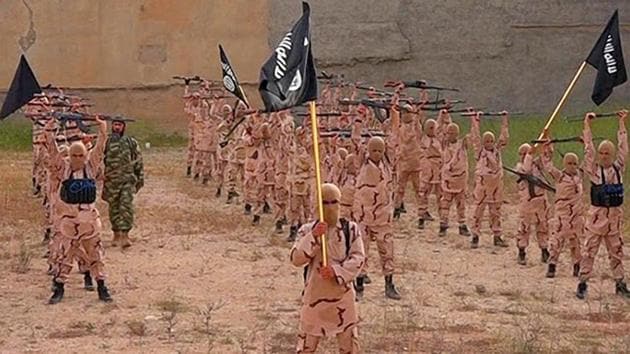 In this photo released on April 25, 2015, by a militant website, young boys known as the “lion cubs” hold rifles and Islamic State group flags as they exercise at a training camp in Tal Afar, near Mosul, northern Iraq. Two men in India pleaded guilty to conspiring for the terror outfit.(Militant website via AP) In this photo released on April 25, 2015, by a militant website, young boys known as the “lion cubs” hold rifles and Islamic State group flags as they exercise at a training camp in Tal Afar, near Mosul, northern Iraq. Two men in India pleaded guilty to conspiring for the terror outfit.(Militant website via AP)