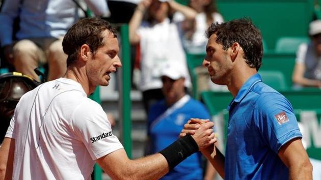 Albert Ramos-Vinolas of Spain (right) shakes hands with Andy Murray of Britain after winning the third round of the Monte Carlo Masters.(Reuters)