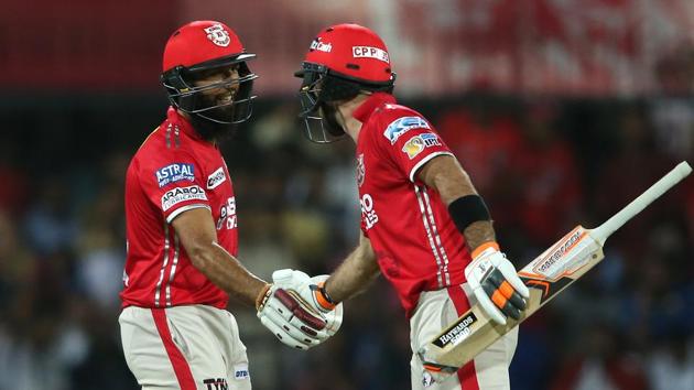 Hashim Amla (left) is congratulated by Kings XI Punjab captain Glenn Maxwell for reaching his fifty against Mumbai Indians. (BCCI)