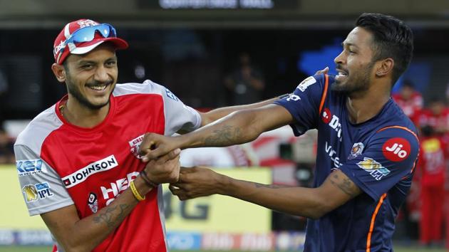 Axar Patel (left) of Kings XI Punjab shares a light moment with Hardik Pandya of Mumbai Indians before their 2017 Indian Premier League match at the Holkar Stadium in Indore on Thursday.  (BCCI) 