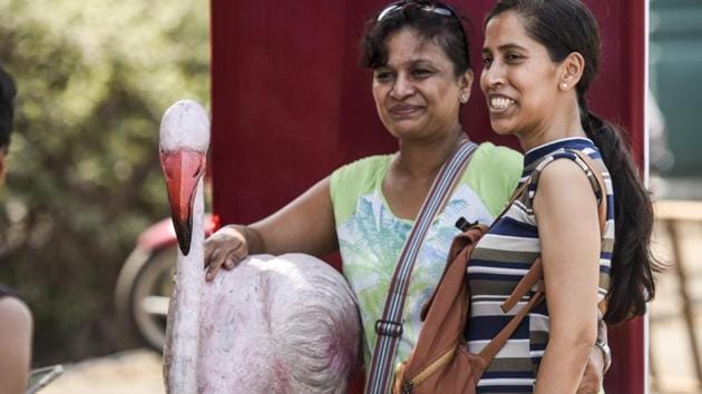 When at the fest, why not a picture with a flamingo? (Kunal Patil/HT Photo)