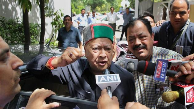 Himachal Pradesh chief minister Virbhadra Singh, accused in a money laundering case, arrives to appear before the Enforcement Directorate (ED) in New Delhi on Thursday.(PTI Photo)