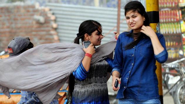 Students at Punjabi University, Patiala during the windy weather. (Bharat Bhushan /HT)
