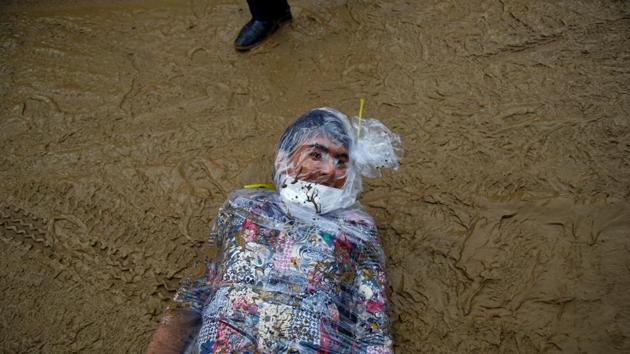 An activist rolls on a muddy road as he takes part in a demonstration to mark Earth Day in Kathmandu, Nepal. (Navesh Chitrakar/REUTERS) An activist rolls on a muddy road as he takes part in a demonstration to mark Earth Day in Kathmandu, Nepal. (Navesh Chitrakar/REUTERS)