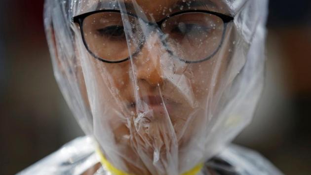 An activist takes part in a demonstration to mark Earth Day by covering herself in a plastic sheet to protest against air pollution and muddy roads caused by what protesters say is a road expansion project in Kathmandu, Nepal. (Navesh Chitrakar/REUTERS) An activist takes part in a demonstration to mark Earth Day by covering herself in a plastic sheet to protest against air pollution and muddy roads caused by what protesters say is a road expansion project in Kathmandu, Nepal. (Navesh Chitrakar/REUTERS)