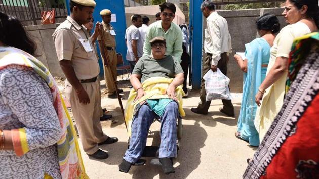 62 year old Lawrence Michael comes out from a polling booth after casting his vote at Jasola. One of the complaints was about a firing incident outside a booth at Dhansa in Najafgarh. (Burhaan Kinu/HT Photo)