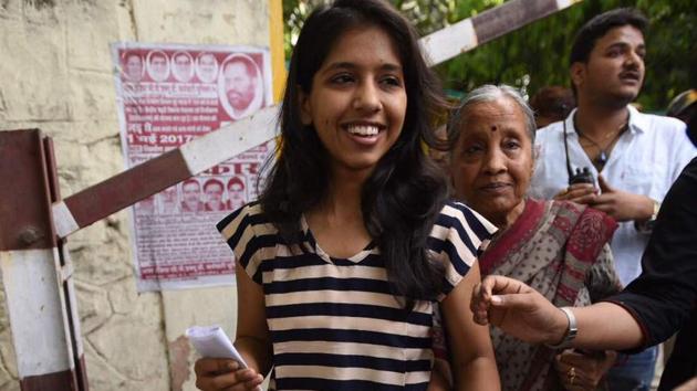 Delhi CM Arvind Kejriwal’s daughter Harsita after casting her first vote at Rajpura road polling station. Elaborate security arrangements are made across the Capital for the election. (Ravi Choudhary/HT Photo)