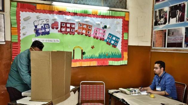 A man pictured while casting his vote at Burari polling station. The civic poll, which comes two months after elections in five states, has assumed national importance as the results are expected to set the political tone beyond the Capital’s boundaries. (Arun Sharma/HT Photo)