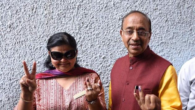 Sports minister Vijay Goel with his Wife pose for a picture after casting their vote at St. Xaviers School near Rajniwas. In all, 18 parties are in the fray this time. Over 2,537 candidates are contesting the polls with as many as 1,174 of them fighting as independents. (Ravi Choudhary/HT Photo)