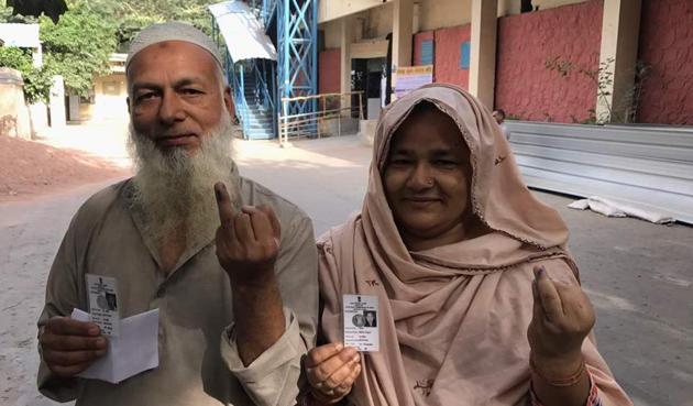 A couple after casting their vote in MCD election at Rajpura Road polling booth in north Delhi.(Ravi Choudhary/HT Photo)