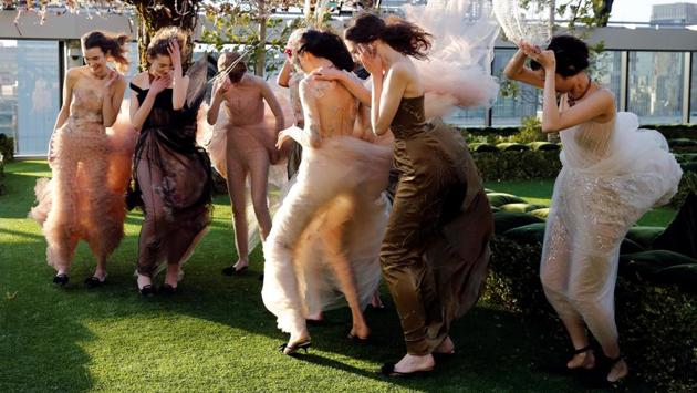 Models struggle against strong wind before the rehearsal of Christian Dior's Haute Couture Spring-Summer 2017 live show to celebrate Dior's new flagship store at the rooftop of Ginza Six mall in Tokyo on April 19, 2017. (Toru Hanai/REUTERS) Models struggle against strong wind before the rehearsal of Christian Dior's Haute Couture Spring-Summer 2017 live show to celebrate Dior's new flagship store at the rooftop of Ginza Six mall in Tokyo on April 19, 2017. (Toru Hanai/REUTERS)