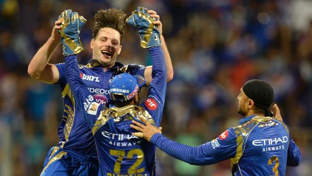 Mumbai Indians pacer Mitchell McClenaghan celebrates with his teammates after taking the wicket of Delhi Daredevils batsman Shreyas Iyer during their 2017 Indian Premier League (IPL) T20 match at the Wankhede Cricket Stadium in Mumbai on April 22.(AFP)