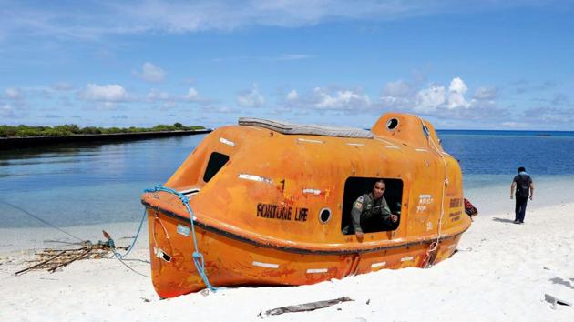A Filipino soldier looks out from a boat in Philippine occupied Thitu island of disputed South China Sea on April 21, 2017. (Erik De Castro/REUTERS) A Filipino soldier looks out from a boat in Philippine occupied Thitu island of disputed South China Sea on April 21, 2017. (Erik De Castro/REUTERS)