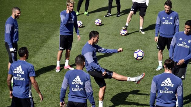 Real Madrid practice ahead of their much anticipated La Liga clash against Barcelona at the Valdebebas training ground in Madrid on the eve of El Clasico. (AFP) Real Madrid practice ahead of their much anticipated La Liga clash against Barcelona at the Valdebebas training ground in Madrid on the eve of El Clasico. (AFP)
