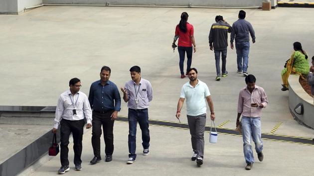 Wipro employees walk inside the company’s compound during a break at their headquarters in Bangalore. The Indian middle class, riding the youthful economic energies unleashed by digital technologies, needs a fresh and hopeful script for its growth story.(AP FILE)
