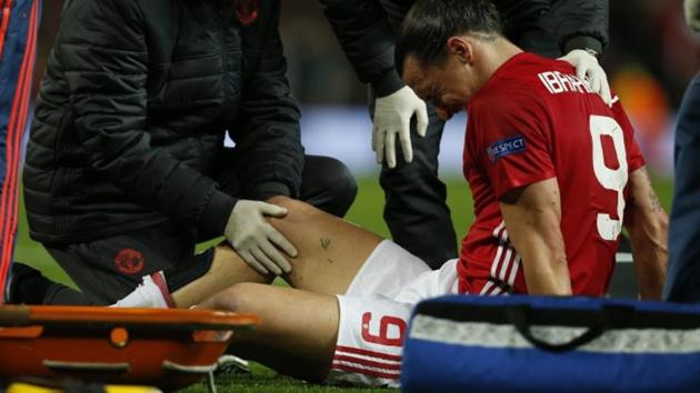 Manchester United's Zlatan Ibrahimovic receives medical attention after sustaining the knee injury during the Europa League match against Amderlecht on Thursday.(Reuters)