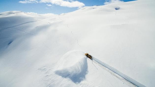 A machine works its way through the snow, clearing the road crossing the mountain Sognefjellet in Norway on April 18, 2017. (REUTERS) A machine works its way through the snow, clearing the road crossing the mountain Sognefjellet in Norway on April 18, 2017. (REUTERS)