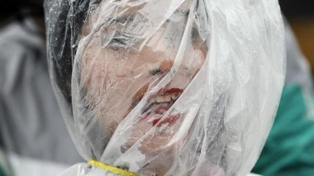 A Nepalese activist stands wrapped in a plastic sheet with a rope tied around her neck to mark of protest against air pollution on Earth Day in Kathmandu, Nepal on April 22, 2017. (Niranjan Shrestha/AP) A Nepalese activist stands wrapped in a plastic sheet with a rope tied around her neck to mark of protest against air pollution on Earth Day in Kathmandu, Nepal on April 22, 2017. (Niranjan Shrestha/AP)