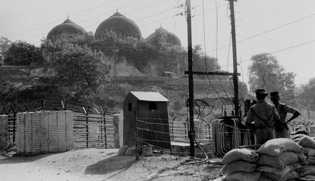 New Delhi: File photo of Babri Masjid in Ayodhya, Nov, 1990. Senior VHP leader Ram Vilas Vedanti, a former BJP MP, along with a Hindu cleric - Abhay Chaitnya, who was carrying a trishul, was allowed to enter the makeshift shrine on Saturday afternoon, the Muslim leaders alleged.(PTI)