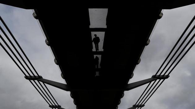 Pedestrians cross the Millenium Bridge in central London on April 17, 2017. (Stefan Wermuth/REUTERS) Pedestrians cross the Millenium Bridge in central London on April 17, 2017. (Stefan Wermuth/REUTERS)
