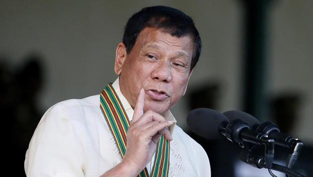 FILE - In this Tuesday, April 4, 2017 file photo, Philippine President Rodrigo Duterte gestures while addressing army troopers during the 120th anniversary celebration of the Philippine Army at Fort Bonifacio in suburban Taguig city, east of Manila. (AP) FILE - In this Tuesday, April 4, 2017 file photo, Philippine President Rodrigo Duterte gestures while addressing army troopers during the 120th anniversary celebration of the Philippine Army at Fort Bonifacio in suburban Taguig city, east of Manila. (AP)