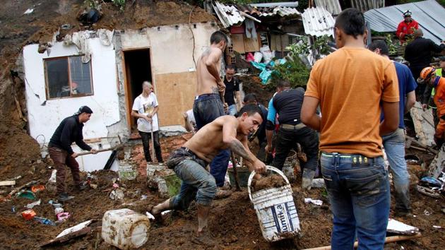 People and rescue agencies look for bodies in a destroyed area after mudslides in Colombia on April 19, 2017. (Santiago Osorio/REUTERS) People and rescue agencies look for bodies in a destroyed area after mudslides in Colombia on April 19, 2017. (Santiago Osorio/REUTERS)