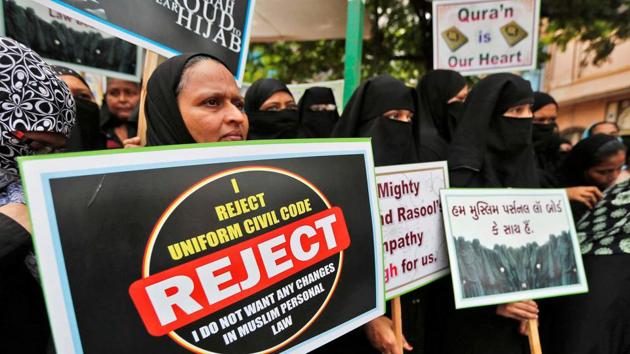 Muslim women hold placards in support of the All India Muslim Personal Law Board during a signature campaign in Ahmedabad.(Reuters File Photo)