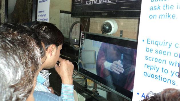 A passenger seeks information about trains using a video-based enquiry system at Jabalpur railway station.(HT File Photo)