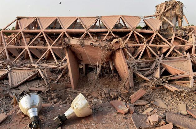 Built in 1972, the iconic Hall of Nations a permanent exhibition venue and a 20th-century heritage site at Pragati Maidan was demolished on Sunday night. This was the country’s first pillar-less building. (Shahbaz Khan / PTI)